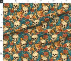 a blue background with skulls and flowers on it, as well as an orange flower