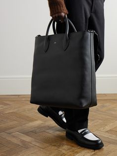 DESIGNED BY MR PORTER. Mr P.'s tote bag is a smart, practical choice for the office. Sized for your laptop, notebook and paperback, it's made from full-grain leather and has an adjustable shoulder strap for easy carrying. Tuck your business cards and chargers in the internal zipped pocket. Luxury Everyday Bags With Laptop Sleeve, Functional Business Tote Briefcase, Timeless Business Briefcase With Removable Pouch, Designer Tote Briefcase For Business, Business Tote Bag With Smooth Grain, Designer Business Briefcase Tote, Designer Business Laptop Bag Tote, Modern Leather Briefcase With Dust Bag, Designer Bags With Smooth Grain For Work