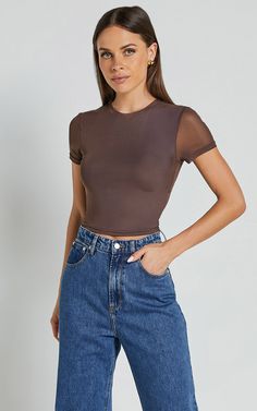 Unleash your inner style goddess with our Rhianna Top! This short sleeve mesh crop top in brown is the perfect addition to your casual wardrobe. Made from high-quality polyester, this fashion-forward piece features a crew neckline and a flattering cropped length. Whether you're heading out for brunch or hitting the dance floor, this trendy top will have you looking effortlessly cool and confident. Pair it with high-waisted jeans or a skirt for an edgy yet chic ensemble that's sure to turn heads. Basic Black Dress, Neon Outfits, Feel Empowered, Bachelorette Dress, Spring Maxi Dress, Navy Bridesmaid Dresses, Mesh Crop Top, Spring Capsule Wardrobe, Trendy Top