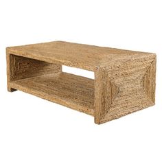 a coffee table made out of straw with one shelf on the bottom and two shelves below it