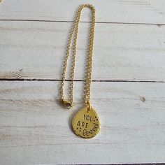 This hand stamped brass necklace will make a great gift for any woman in your life. Choose from 4 different sayings, for the perfect gift for anyone! Choose your saying from the drop down menu on the listing.The brass charm is approx 1" x 3/4" and is attached to an 18" gold plated stainless steel chain. The charm has a lightly brushed finish, hammered edges, and is hand stamped to order, using the quote that you selected. The stamped impression is then filled in with a long lasting black ink.If Necklace Trendy, Handmade Brass, Brass Charms, Brass Necklace, Just Breathe, Brass Jewelry, Drop Necklace, Trendy Jewelry, Steel Chain