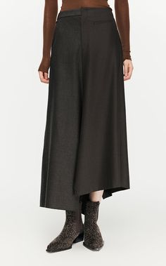 97% woolen 3% polyester Chic A-line Winter Bottoms, Fitted Maxi Skirt For Fall Workwear, Chic Wool A-line Skirt, Elegant A-line Bottoms For Winter, Full Length Wool Bottoms For Fall, Chic Flowy Wool Skirt, Asymmetrical Lined Skirt For Work, Lined Asymmetrical Skirt For Work, Tailored Long Skirt For Work