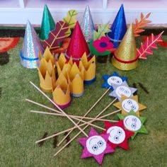 there are many party hats and sticks on the floor