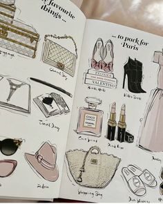 an open book with drawings of women's purses and handbags on it