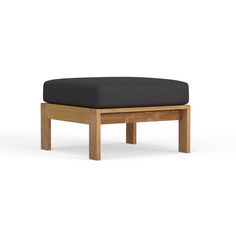 a wooden bench with a black cushion on the top and bottom part, in front of a white background