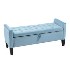 a light blue bench with black legs and tufted upholstered backrests