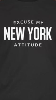 a man wearing a black t - shirt that says, because my new york attitude