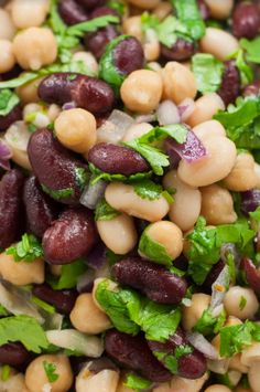 a salad with beans, lettuce and cilantro