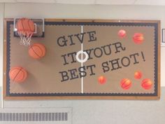 a sign that says give it to your best shot with basketballs on the court