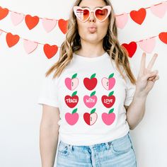 Check out the perfect blend of passion and education with our exclusive collection of teacher shirts for Valentine's Day. Explore a range of stylish and comfortable Valentine's Day teacher shirts that blend love and learning seamlessly. Our Teach With Love tee is the best Velantines Day teacher shirt to show your [First Year Teacher, math, history, kindergarten, second grade, third grade, sixth grade, art, and more] class you care. If you're looking for a cute shirt idea for teachers this year l History Kindergarten, Math History, First Year Teacher, Message For Teacher, Teaching Shirts, Teacher Team, Love Teacher, First Year Teachers, Teacher Mom