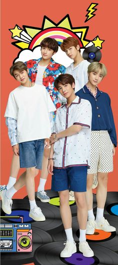 four boys standing on top of a turntable in front of an orange background with boomboxes