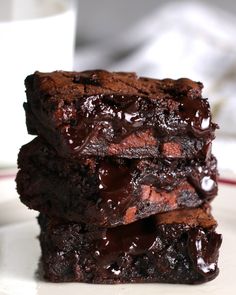 three chocolate brownies stacked on top of each other