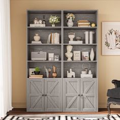 a living room with a gray bookcase and black chair