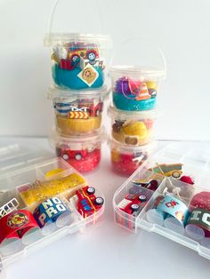 several plastic containers filled with different types of toys