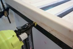 a close up of a piece of wood being worked on by a person with a power tool