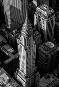 black and white photograph of the top of buildings in new york city's financial district