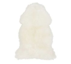 a white sheepskin rug on a white background