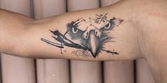 an eagle tattoo on the left arm and right arm with black paint splatters