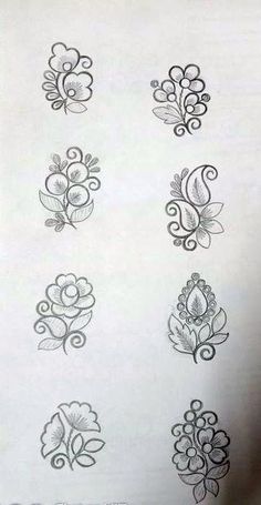 some flowers are drawn on a piece of paper