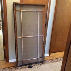 an old window is sitting on the floor