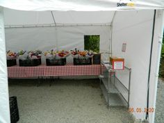 the table is set up with many bags and flowers on it for guests to enjoy