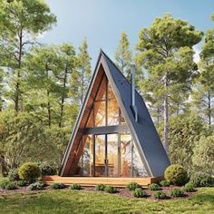 a - frame cabin in the woods surrounded by trees