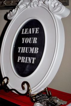 there is a sign that says leave your thimb print