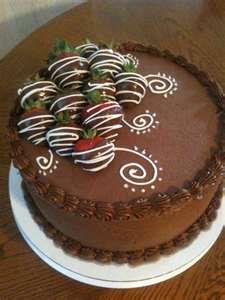 a chocolate cake sitting on top of a white plate