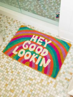 a bathroom rug with the words hey good looking on it