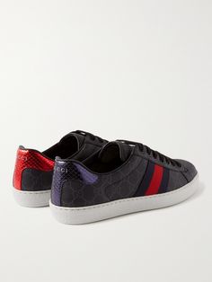 Alessandro Michele subtly reworks Gucci's 'Ace' sneakers each season. This pair has been made in Italy from canvas woven with the house's 'GG Supreme' monogram and trimmed with leather and metallic snake-effect heel tabs in contrasting blue and red. Gucci Leather Sneakers With Embroidered Logo, Gucci Designer Sneakers With Embroidered Logo, Gucci Custom Sneakers With Embroidered Logo For Streetwear, Designer Gucci Sneakers With Embroidered Logo, Sporty Gucci Sneakers With Embroidered Logo, Gucci Custom Low-top Sneakers With Embroidered Logo, Custom Gucci Low-top Sneakers With Embroidered Logo, Gucci Custom Lace-up Sneakers With Embroidered Logo, Luxury Black Sneakers With Embroidered Logo