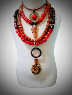 Ocean Jasper and Coral Layered Necklace Authentic "Western " style layered necklace. Made with large farm raised red coral stones, red agate beads, red and black banded agate, and large ocean jasper stones. Finishes are genuine leather cords, ocean jasper arrowhead pendant, and antique Asian style pendant. Red Natural Stones Beaded Necklace, Red Jasper Spiritual Necklace, Unique Red Multi-strand Beaded Necklaces, Unique Red Multi-strand Beaded Necklace, Red Multi-strand Necklaces With Natural Stones, Unique Red Agate Beaded Necklaces, Bohemian Beaded Necklaces With Red Coral, Artisan Red Agate Jewelry, Unique Red Coral Jewelry With Polished Beads