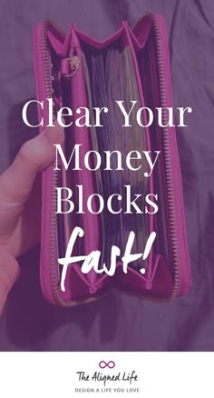 a pink purse with the words clear your money blocks fast