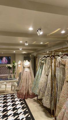 there are many dresses on display in the store