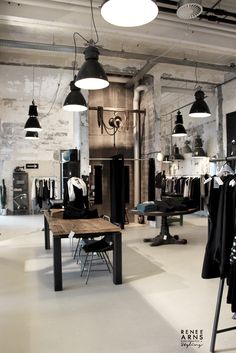 an industrial style clothing store with black and white lighting