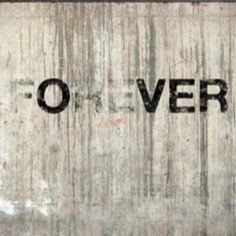 the word o'ver written in black on a concrete wall