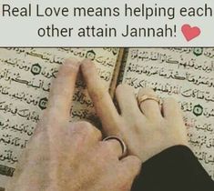 someone is writing on a book with the words real love means helping each other attain jannah