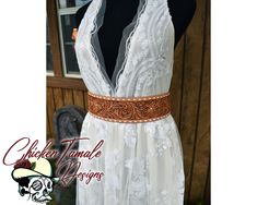 This is your missing piece! This belt is 2 1/2 inches wide, hand tooled leather bridal belt, with lace up corset style size adjustment, the lace can be changed out with your custom color. Belt size, laced up completely the belt is 32inches, and can be let out to 36inches, it can be adjusted to fit ever larger, you will just have a larger gap. Original design by Samantha Smart, floral style tooling, with white accent color, and hand sewn with white kangaroo buckstitch. beautiful lining detail for strength and comfort This belt is ready to ship, if you are interested in a custom build for you, just send me a message for a quote. Wedding Belt Buckles, Leather Wedding Belt, White Kangaroo, Cinch Belt, Lace Up Corset, Wedding Sash Belt, Leather Wedding, Wide Leather Belt, Wedding Belts