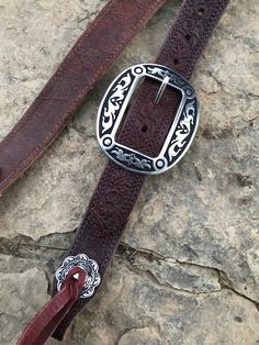 "Hand made 1.5\" wide headstall with buckle. These headstalls are made in our shop and are made to order. Buckles may vary as inventory changes and new styles are released. They are made from Heavy 14/16 ounce Herman Oak leather. Embossed with the Western Floral, Basketweave, Plain, and soon barbwire. Jermiah Watt Hardware is used and is top quality stainless steel hardware. These headstall get compliments wherever you go and a great using piece of tack." Adjustable Western Concho Belt Buckles, Adjustable Concho Belt Buckles For Western-themed Events, Western Style Adjustable Belts For Western-themed Events, Western Brown Adjustable Belt Buckles, Traditional Adjustable Brown Belt Buckles, Adjustable Western Belts For Rodeo, Western Belts With Antique Buckle And Adjustable Fit, Adjustable Brown Traditional Belt Buckles, Western Belt With Antique Buckle And Adjustable Fit