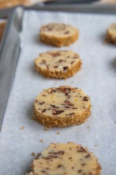 several cookies are on a baking sheet ready to be baked