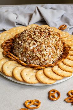 a plate with pretzels and crackers on it