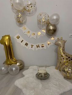 a giraffe birthday party with balloons and decorations