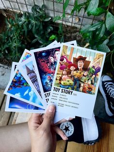 someone is holding up some toy story cards