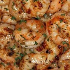 closeup of cooked shrimp with parsley on top