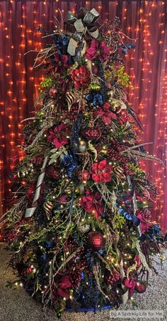 Florals and Flourishes - A Botanical Christmas Tree Dark Blue And Red Christmas Tree, Burgundy And Blue Christmas Decor, Navy Red Christmas Decor, Bell Themed Christmas Tree, Navy Blue And Burgundy Christmas Tree, Navy Red Christmas Tree, Red Green Blue And Gold Christmas Tree, Navy And Burgundy Christmas Tree, Red Blue Green Gold Christmas Tree