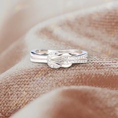 If you're looking for a beautiful and sentimental way to show your love and appreciation for your best friend, this ring is a perfect choice. The sleek and stylish design will compliment any outfit and the adjustable band ensures she can wear it however she wants. The ring is intricately crafted with a delicate knot design, symbolizing the unbreakable bond between friends. Whether you wear it as a daily reminder of your special bond or give it to your bestie as a gift, she is sure to cherish thi