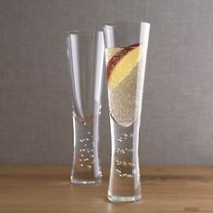 there are two glasses that have some liquid in them