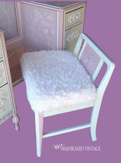 an image of a chair and dresser with fur on the seat cover in front of it