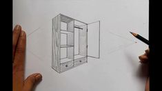 someone is drawing an object with pencils on paper and it looks like a cabinet