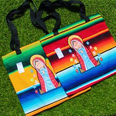 Carry a piece of Mexican tradition with you wherever you go with this beautifully handcrafted Virgin Mary  sarape bag. Measuring 13 inches by 12 inches, this versatile tote features a vibrant sarape design, accented with the revered image of Baby Virgin Mary. The bag is made in Mexico and comes with a secure zipper closure, making it perfect for daily use, shopping trips, or as a unique cultural gift. The blend of bright colors and meaningful symbolism makes this bag a standout accessory that celebrates both faith and heritage. Highlights: Handmade in Mexico Virgin Mary  design Vibrant sarape pattern Secure zipper closure Size: 13" x 12" Perfect for everyday use or gifting Celebrate faith and culture with this striking Mexican sarape bag featuring Virgin Mary! Large Multicolor Bag For Gifts, Large Multicolor Bag Perfect For Gifts, Sarape Pattern, Virgin Mary Design, Mexican Sarape, Mexican Traditions, Handmade Tote, Bag With Zipper, San Antonio Tx