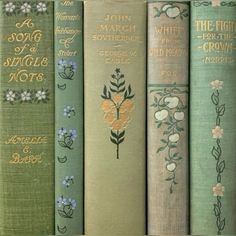 four books are lined up next to each other with flowers on the front and back covers